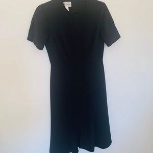 Donna Morgan sleek and classic black work dress.